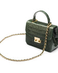 Small leather top handle bag, green croc, side