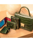 Small leather top handle bag, green croc, lifestyle