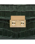 Small leather top handle bag, green croc, lock close up