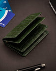 Leather bifold card wallet, green croc, lifestyle