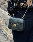 Small real python top handle bag, green, lifestyle