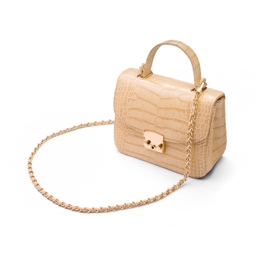 Small leather top handle bag, ivory croc, side