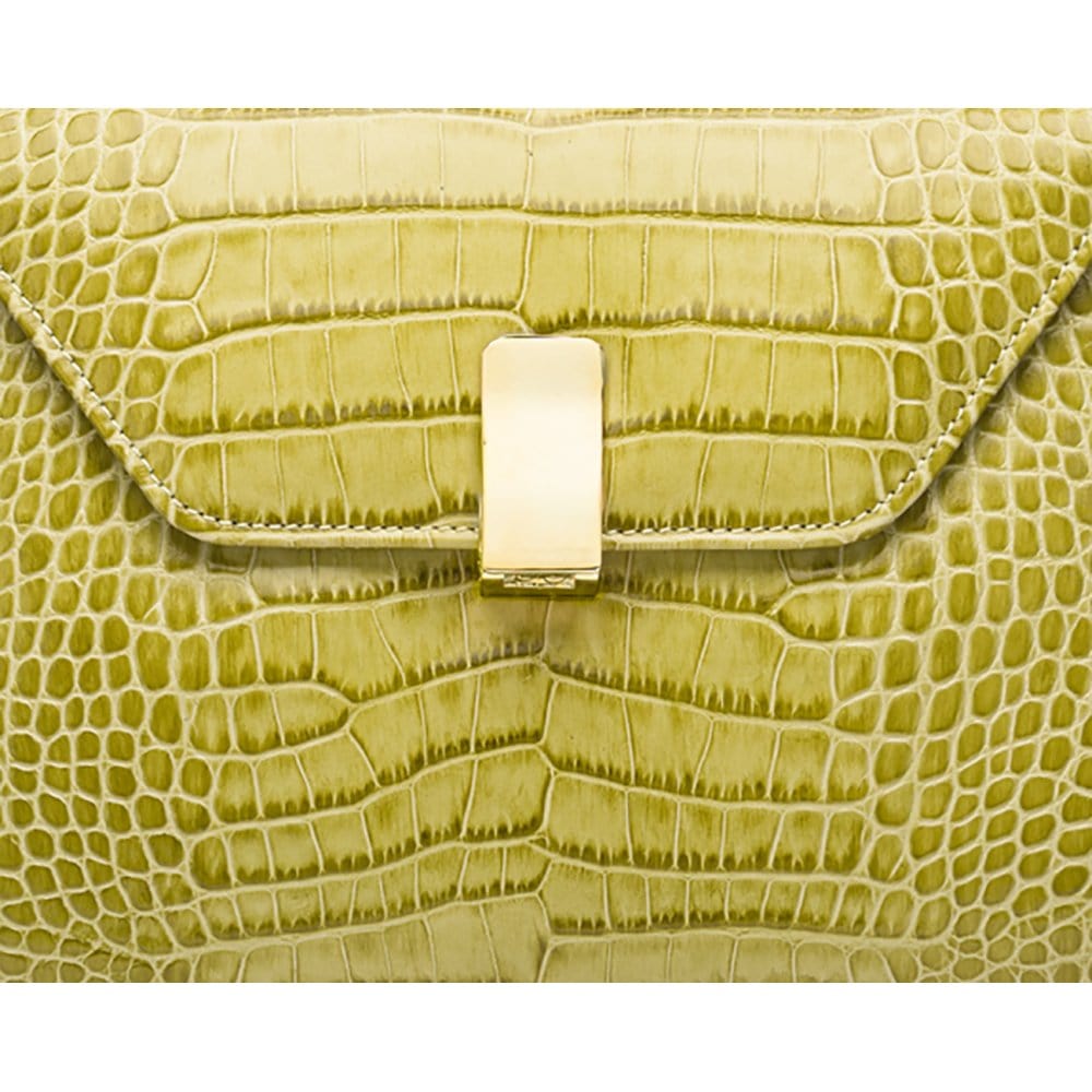 Leather top handle bag, lime green croc, lock closeup