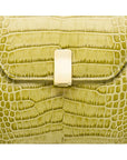 Leather top handle bag, lime green croc, lock closeup