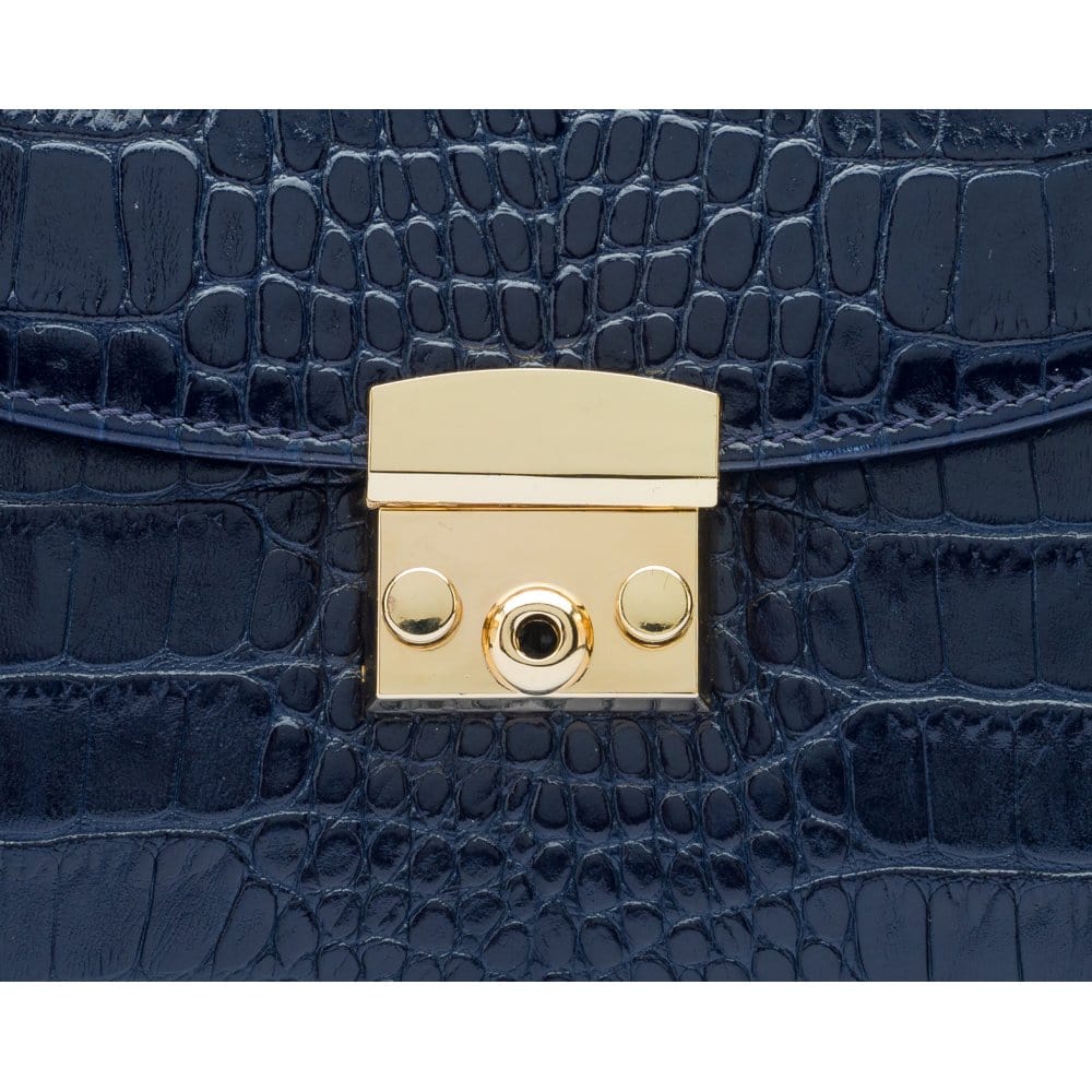Small leather top handle bag, navy croc, lock close up