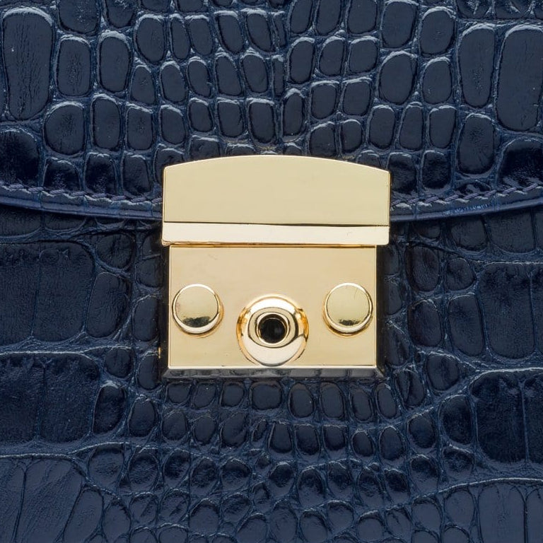 Small leather top handle bag, navy croc, lock close up