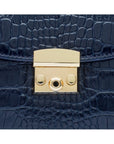 Small leather top handle bag, navy croc, lock close up