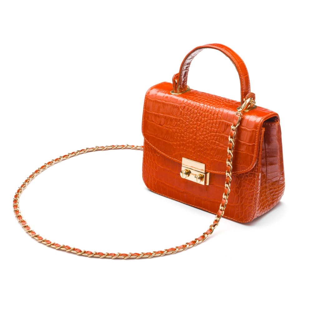 Small leather top handle bag, orange croc, side