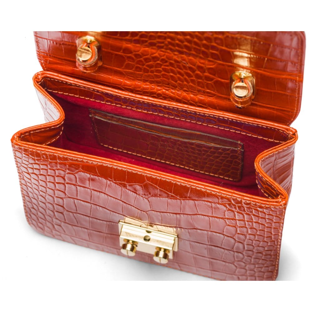 Small leather top handle bag, orange croc, inside