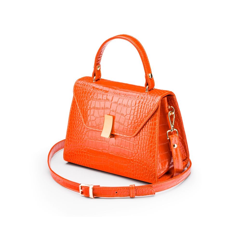 Leather top handle bag, orange croc, side view