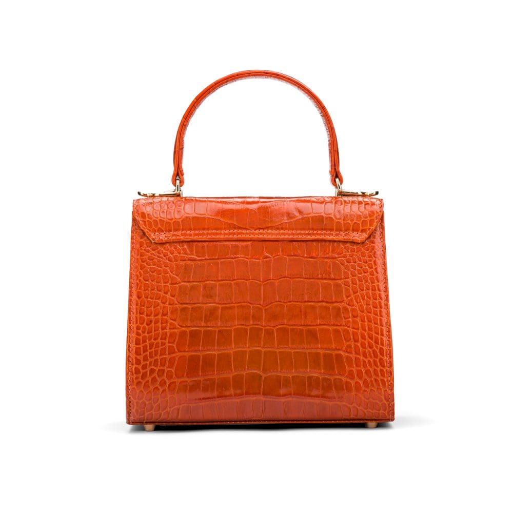 Mini leather Morgan Bag, top handle bag, orange croc, back view