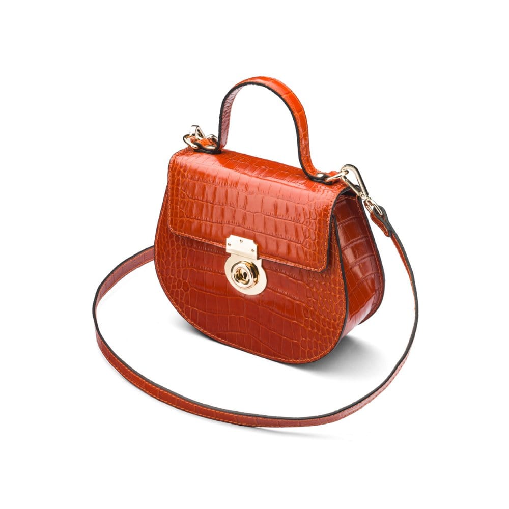 Leather rounded bottom top handle bag, orange croc, side