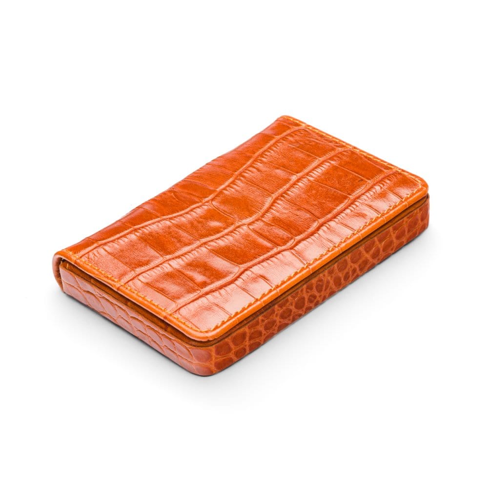 Leather business card holder with magnetic closure, orange croc, side