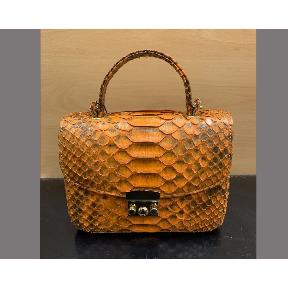 Small real python top handle bag, orange, front