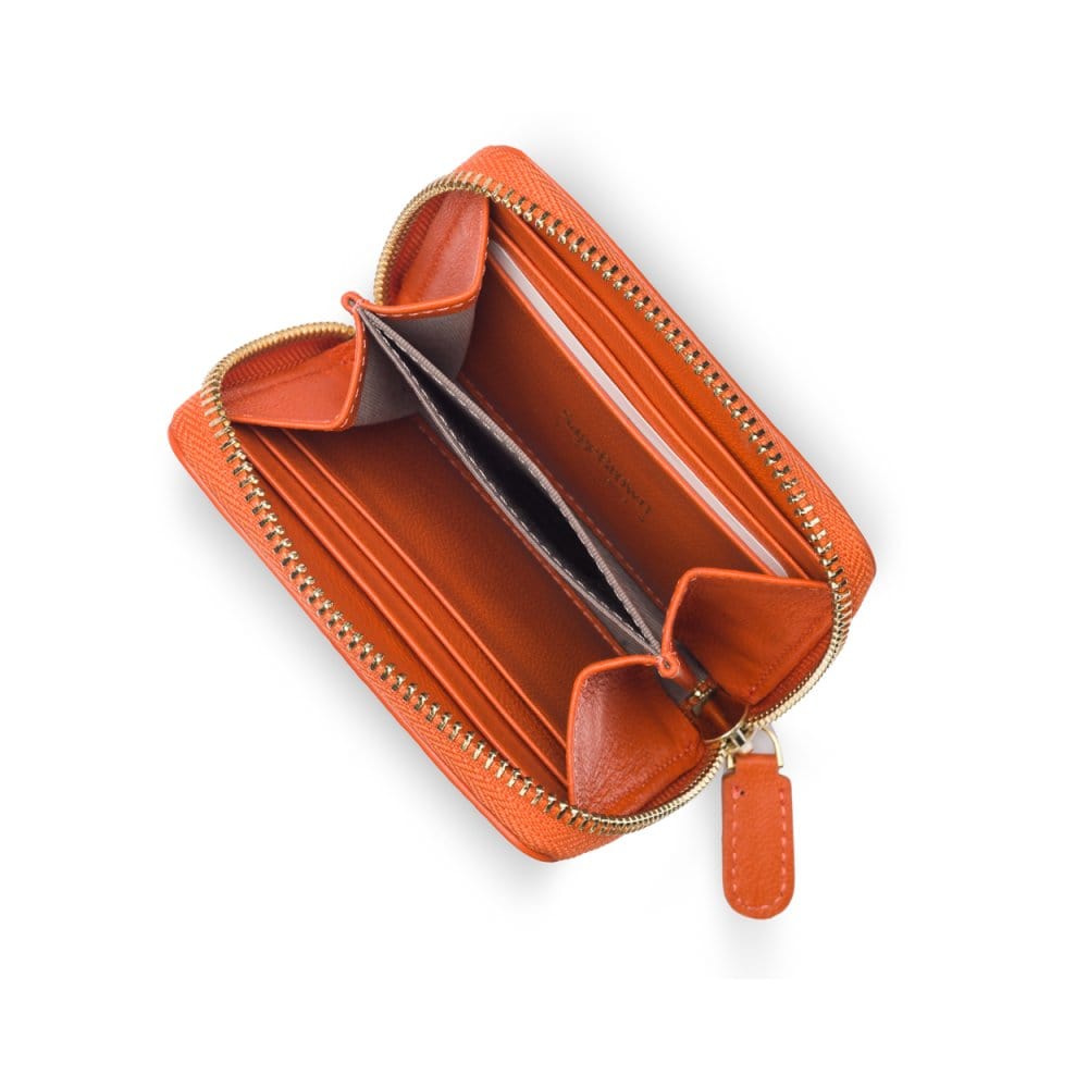 Small zip around woven leather accordion purse, orange, interior