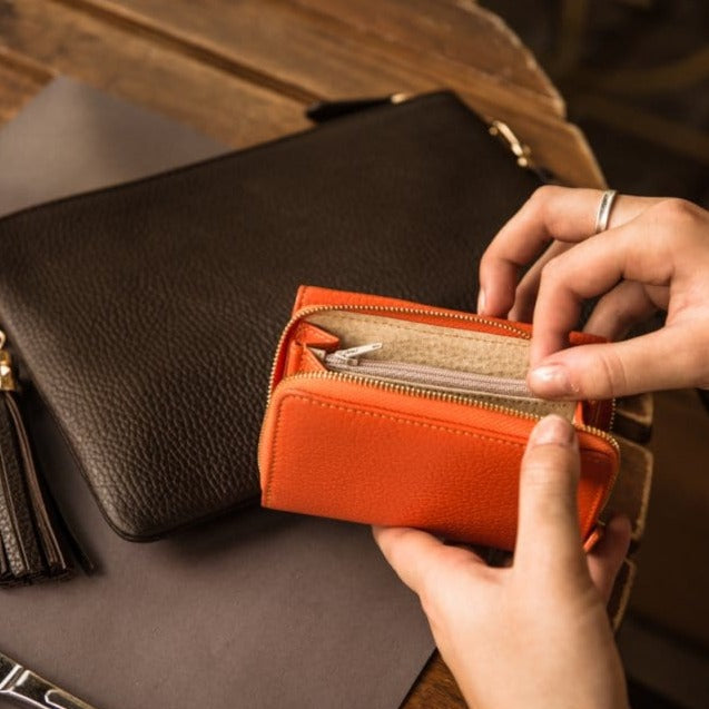 RFID blocking leather tri-fold purse, orange, lifestyle