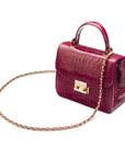 Small leather top handle bag, pink croc, side