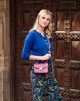 Small leather top handle bag, pink croc, lifestyle