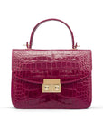 Small leather top handle bag, pink croc, front