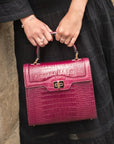 Leather signature Morgan bag, pink croc, lifestyle view