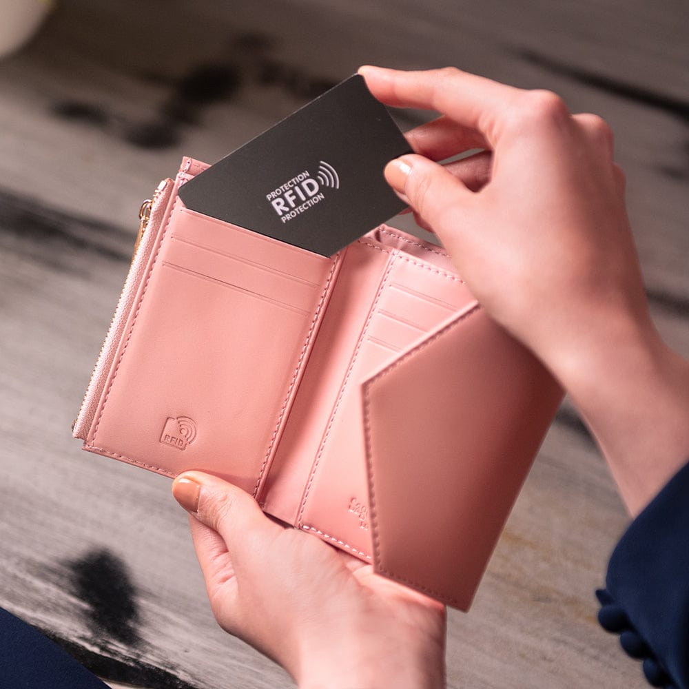RFID blocking leather envelope purse, pink, lifestyle view