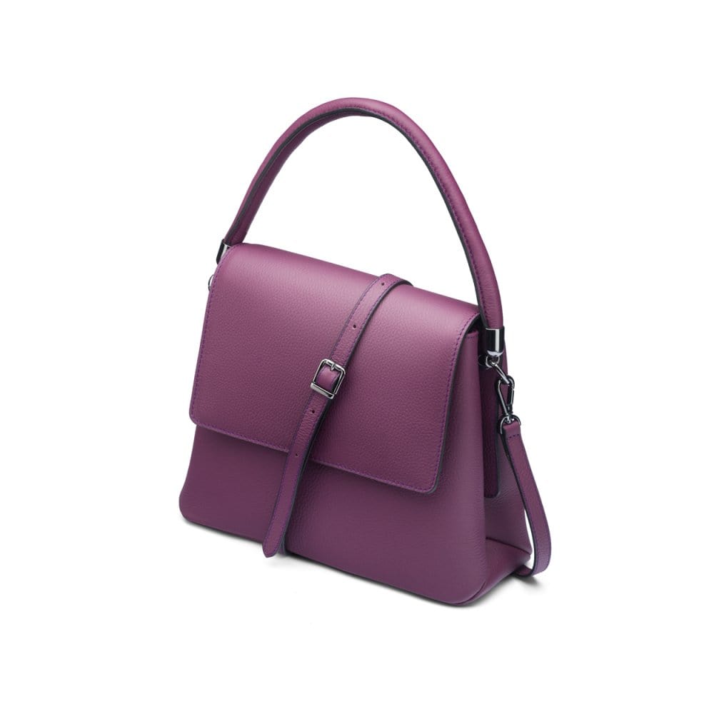 Leather handbag with flap over lid, purple, side view