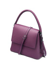 Leather handbag with flap over lid, purple, side view