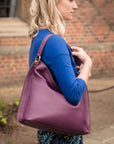 Slouchy leather shoulder bag, purple, lifestyle