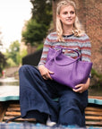 Woven leather slouchy bag, purple, lifestyle