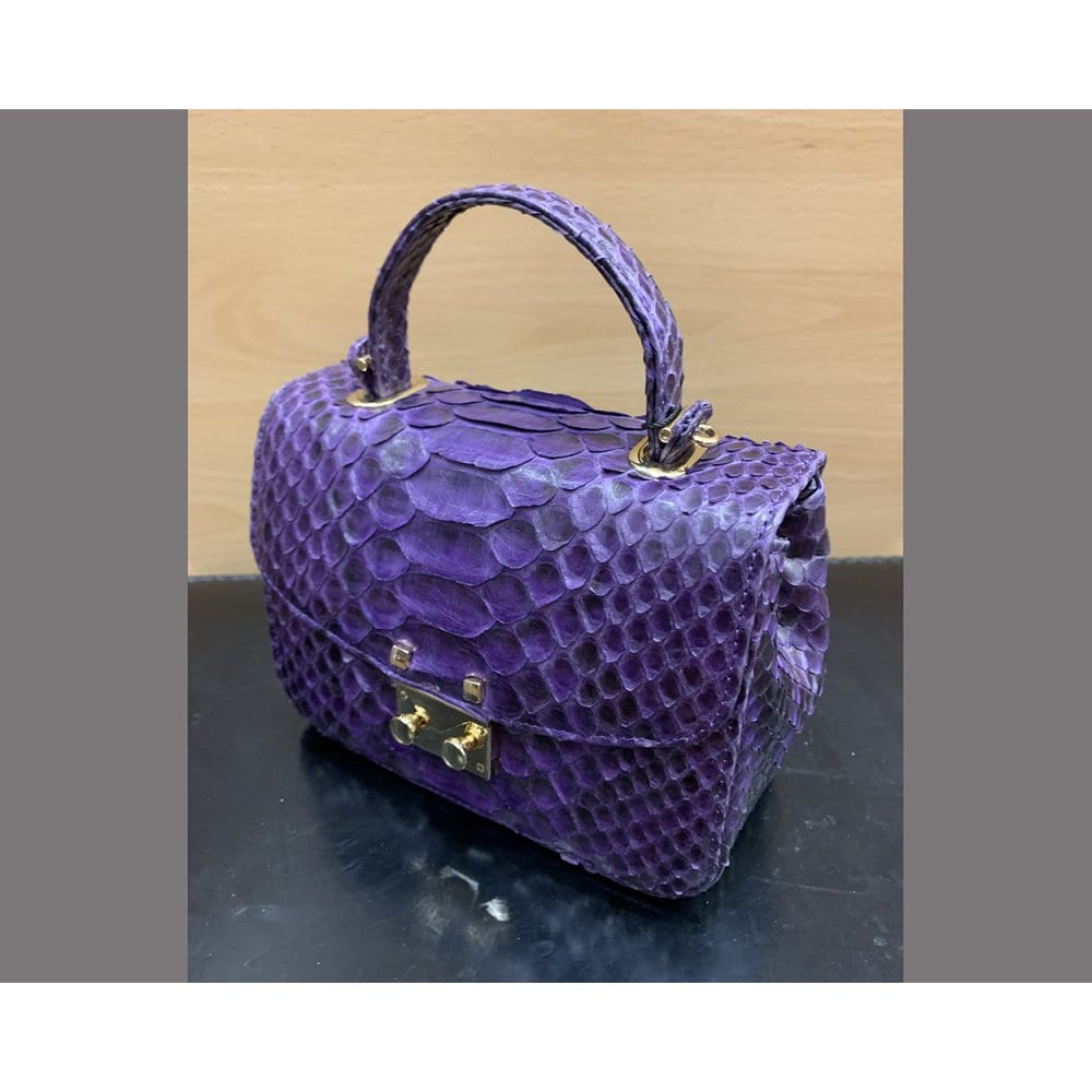 Small real python top handle bag, purple, side