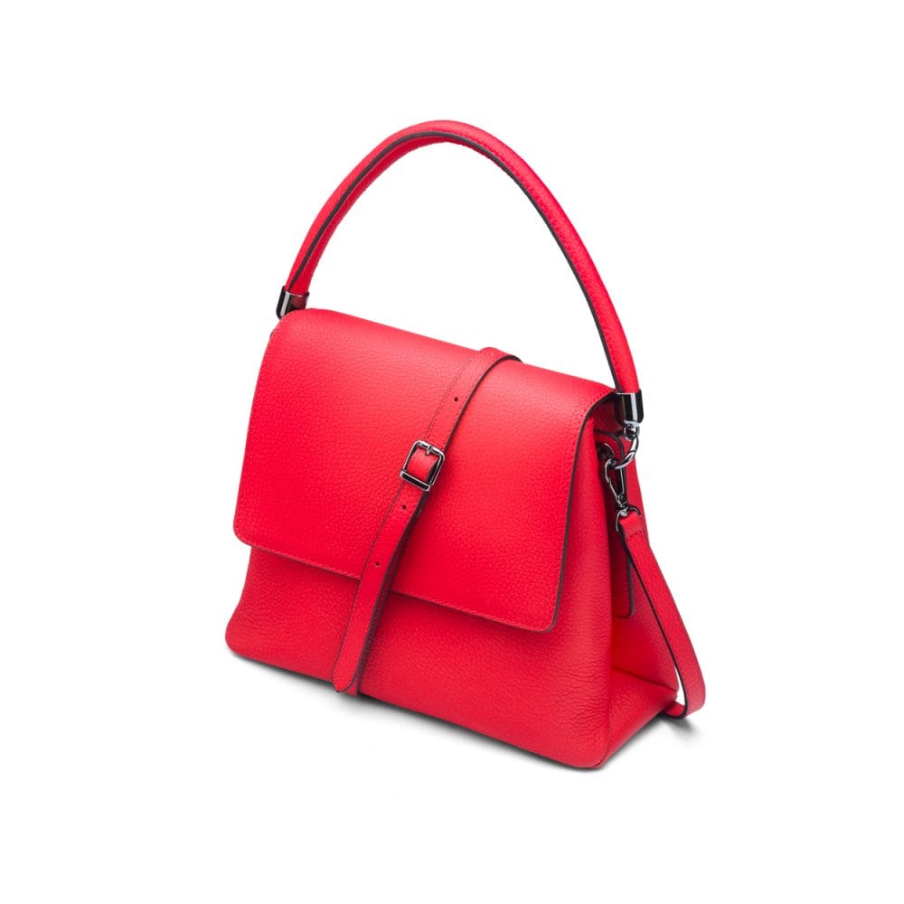 Leather handbag with flap over lid, red, side view