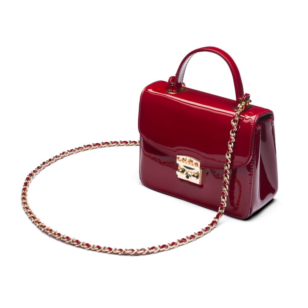 Small leather top handle bag, red patent, side
