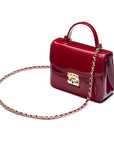 Small leather top handle bag, red patent, side