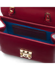 Small leather top handle bag, red patent, inside