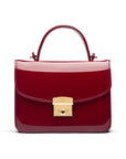 Small leather top handle bag, red patent, front