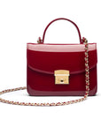 Small leather top handle bag, red patent, with chain strap