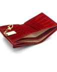 Leather purse with brass clasp, red croc, inside