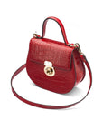 Leather rounded bottom top handle bag, red croc, side