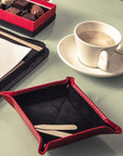 Small leather valet tray, red with black, lifestyle