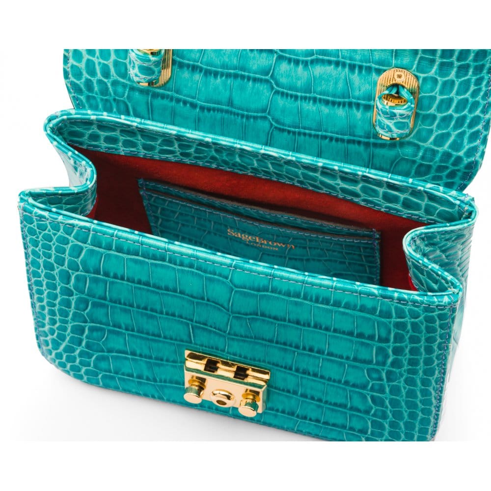 Small leather top handle bag, turquoise croc, inside
