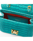 Small leather top handle bag, turquoise croc, inside