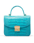 Small leather top handle bag, turquoise croc, front