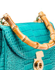 Bamboo handle bag, turquoise croc, handle close-up