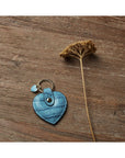 Leather heart shaped key ring, turquoise croc, lifestyle