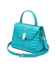 Leather top handle bag, turquoise croc, side