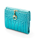 Leather purse with brass clasp, turquoise croc, front view