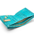 Leather purse with brass clasp, turquoise croc,, inside