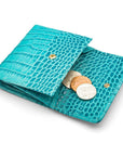 Leather purse with brass clasp, turquoise croc, open