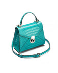 Mini Burnett small top handle bag, turquoise croc, side view