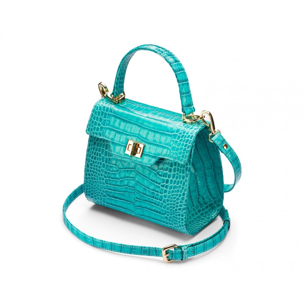 Mini leather Morgan Bag, top handle bag, turquoise croc, side view